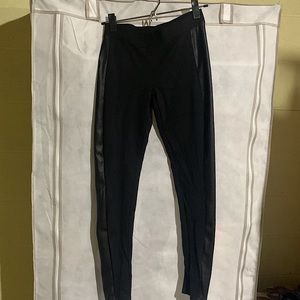 Black express work pants with faux leather detailing on the sides